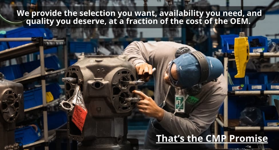 CMP technician remanufacturing a commercial compressor at a parts-lined workstation in the CMP facility